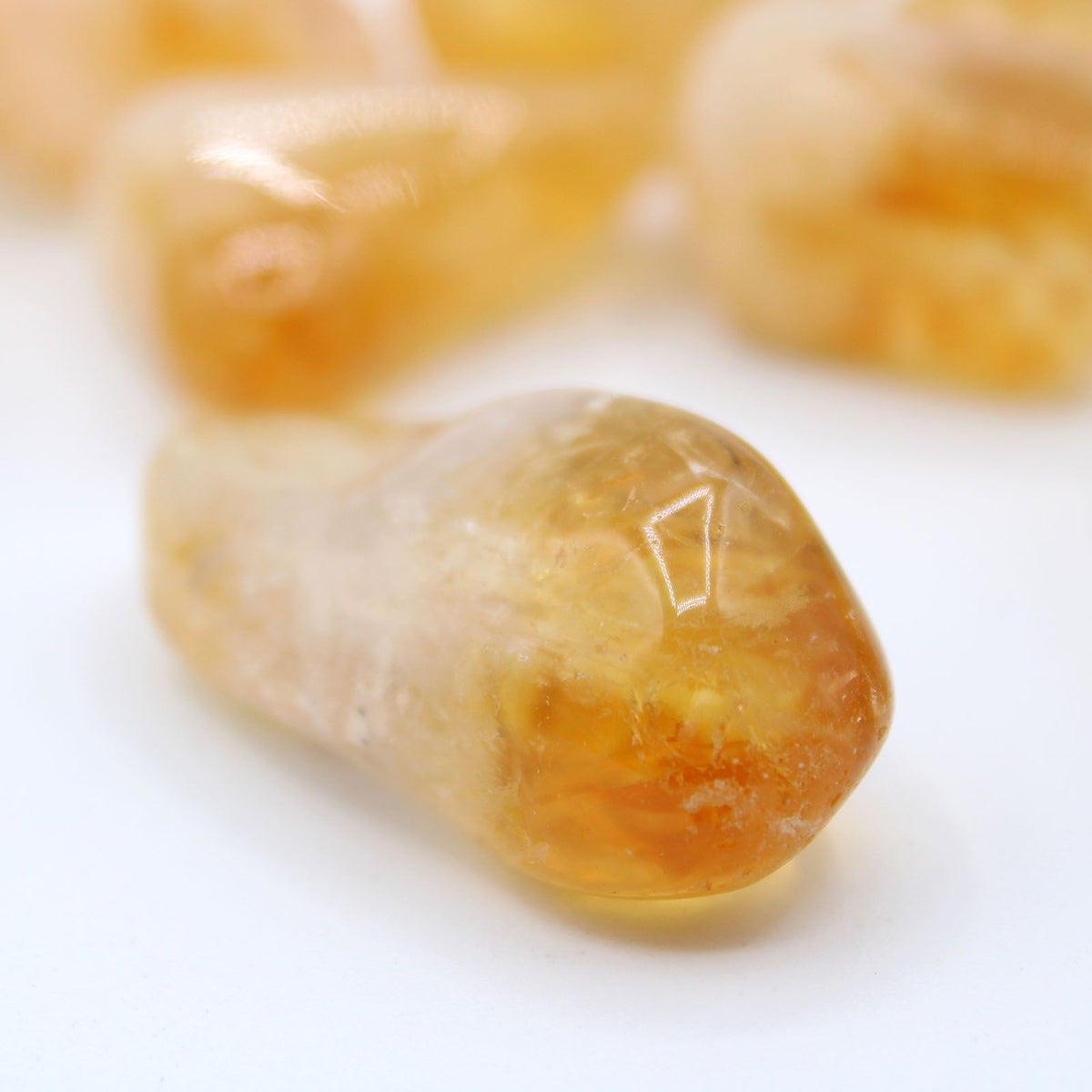 Large tumble stones in golden citrine sourced from Brazil, a natural crystal gift